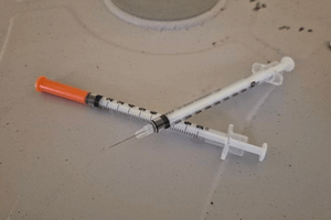 Discarded Syringe Discarded Used Syringe with no cap