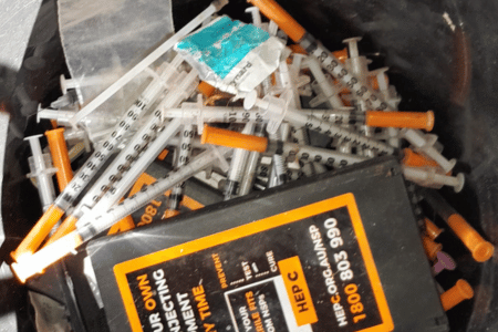 Bucket of Syringes Syringe Cleanup Services