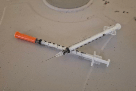 Discarded Syringe Discarded Used Syringe with no cap